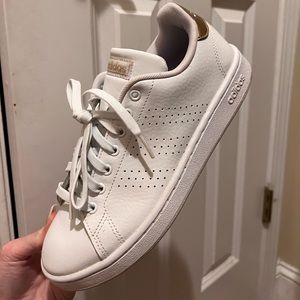 Women’s white Adidas sneakers